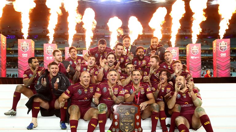 Queensland celebrate with the State of Origin trophy