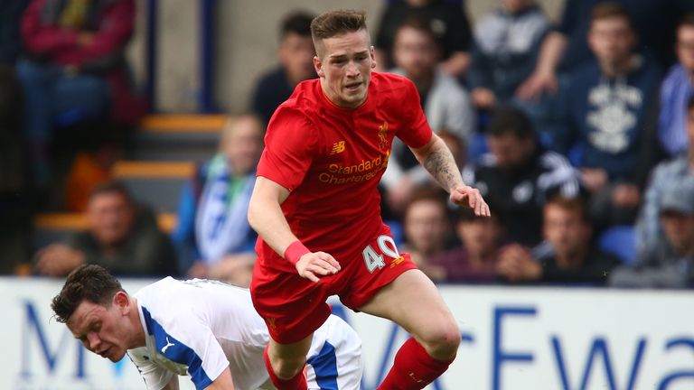 BIRKENHEAD, ENGLAND - JULY 08: Ryan Kent of Liverpool gets past Connor Jennings of Tranmere Rovers during the Pre-Season Friendly match between Tranmere Ro