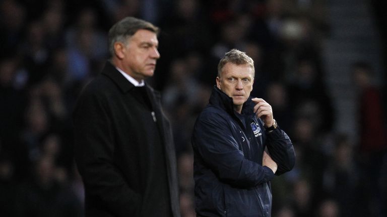 Everton's Scottish manager David Moyes (R) looks towards West Ham United's English manager Sam Allardyce (L) 