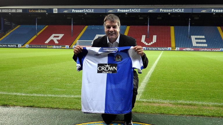 New Blackburn Rovers football club manager Sam Allardyce poses with a football shirt at a press conference at the club's Ewood Park stadium in Blackburn