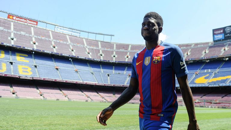 Samuel Umtiti smiles during his official Barcelona presentation at the Camp Nou