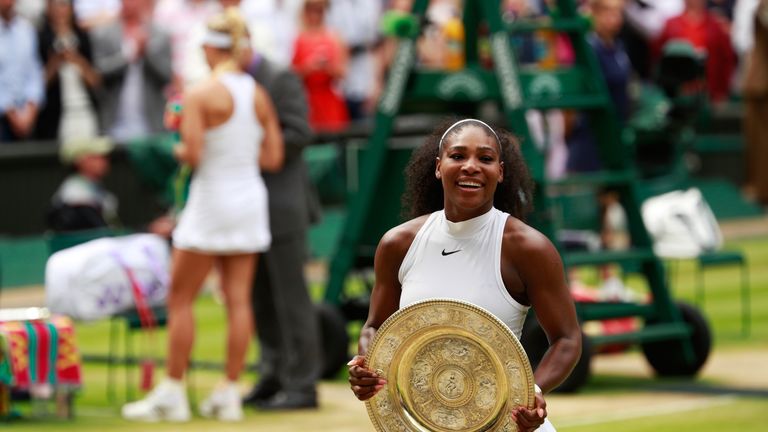 Serena Williams lifts the trophy