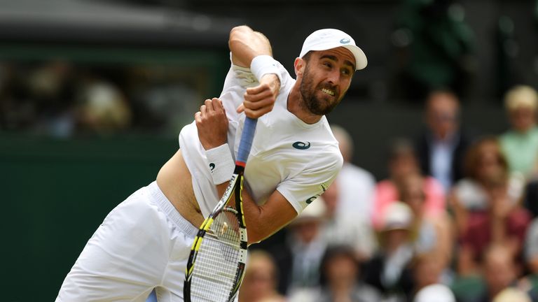 LONDON, ENGLAND - JULY 04:  Steve Johnson of The United States serves during the Men's Singles fourth round match against Roger Federer of Switzerland on d