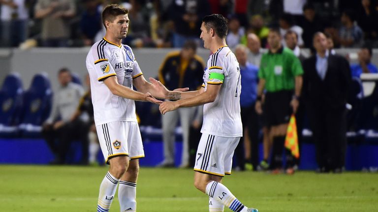Robbie Keane of the LA Galaxy  (R) celebrates with Steven Gerrard (L) after scoring the equalizer against Club America off a pass from Garrard, the ex-Live