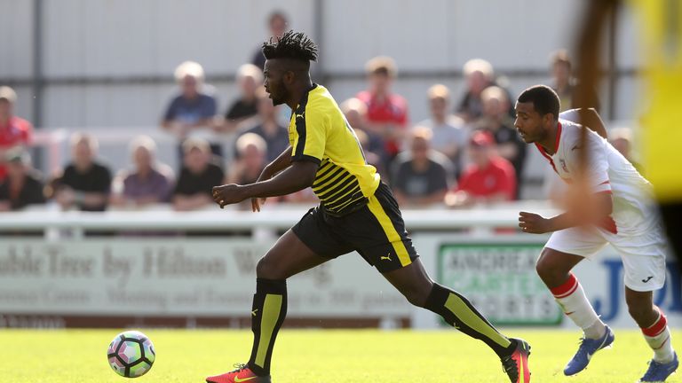 WOKING, ENGLAND - JULY 10:  Isaac Success of Watford runs with the ball during the pre season friendly match between Woking and Watford at The Laithwaite C