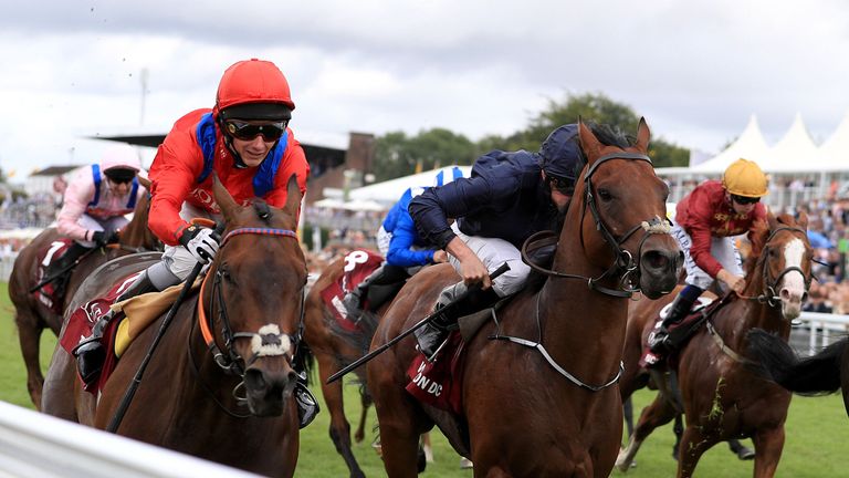 Take Cover (left), ridden by David Allen, sees off Washington DC to win the Qatar King George Stakes 