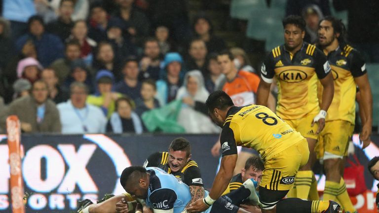 Taqele Naiyaravoro crosses for the Waratahs