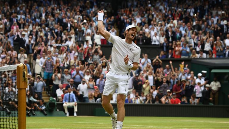 Andy Murray celebrates beating Milos Raonic after the men's singles final match at Wimbledon