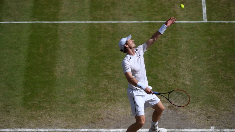 Andy Murray serves during the Men's Singles Final against Milos Raonic at Wimbledon