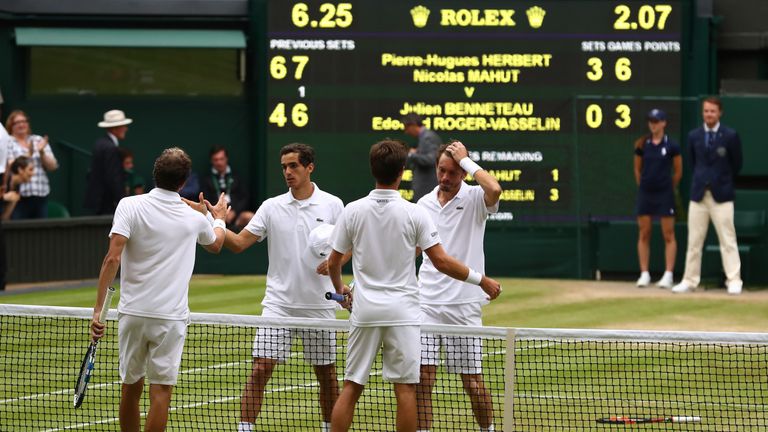 LONDON, ENGLAND - JULY 09:  Nicolas Mahut of France (BR) and Pierre-Hugues Herbert of France (BL) shake hands with Julien Benneteau (FR) of France and Edou