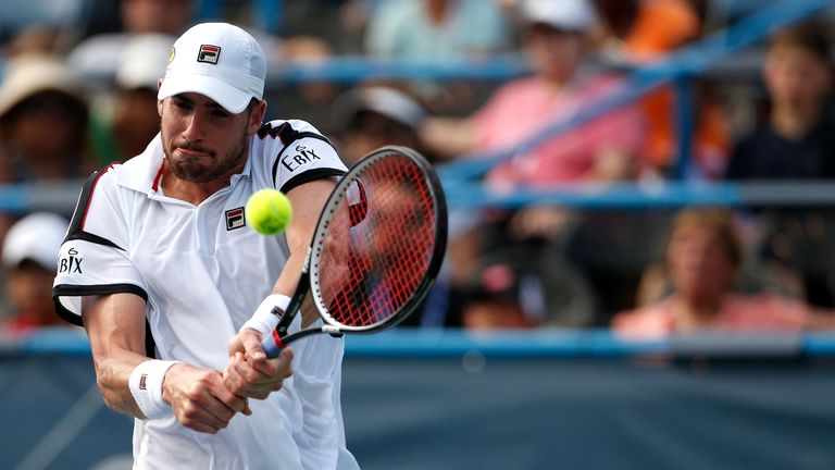 WASHINGTON, DC - JULY 22: John Isner of the United States of America returns a shot to Steve Johnson of the United States of America during day 5 of the Ci