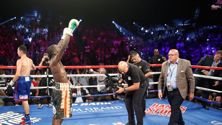 WBO junior welterweight champion Terence Crawford raises his arms in victory after going 12 rounds against WBC champion Viktor Postol
