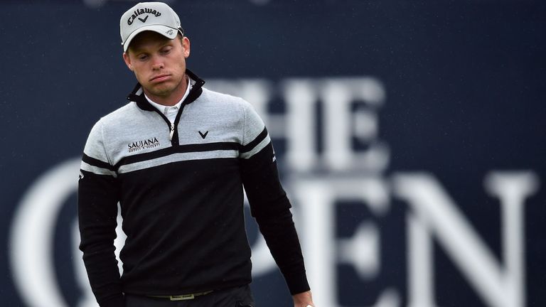 Danny Willett reacts on the 18th green during his second round on day two of the 2016 Open