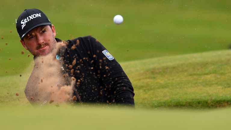 Northern Ireland's Graeme McDowell plays from a green-side bunker on the 13th hole during his second round on day two of the 2016 British Open Golf Champio