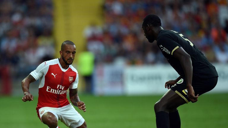 Arsenal's English forward Theo Walcott (L) vies with French Lens's defender Abdoul Ba  during the football match Lens versus Arsenal on July 22 2016, at th