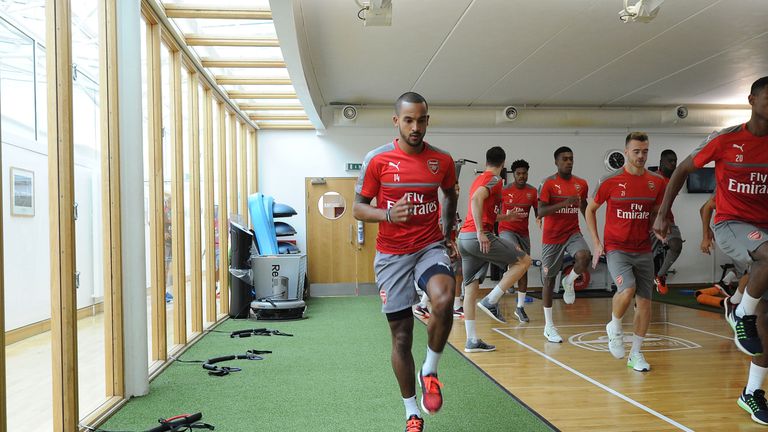 Theo Walcott takes part in an Arsenal pre-season training session at London Colney
