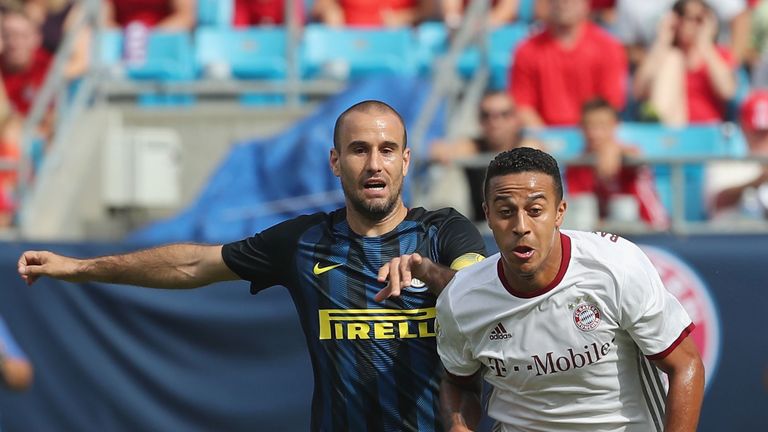 Thiago (R) of Bayern Munich fights for the ball with Rodrigo Palacio of Inter Milan during the International Champions Cup match in Charlotte