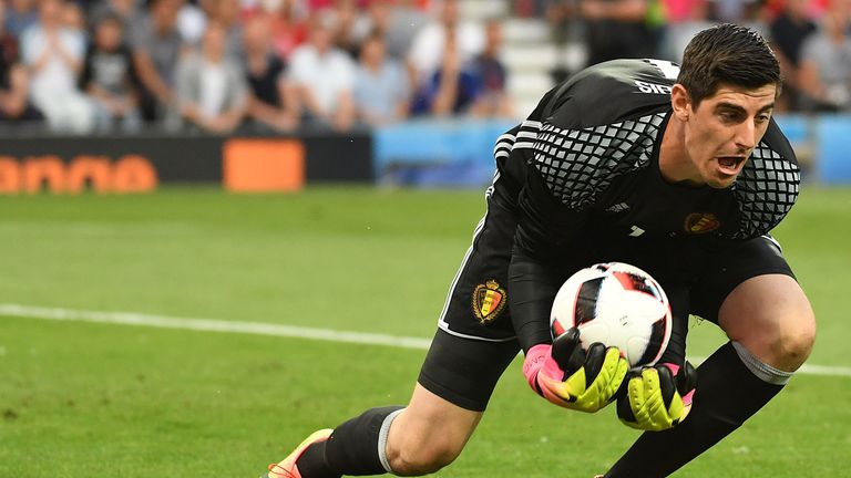 Belgium's goalkeeper Thibaut Courtois catches the ball