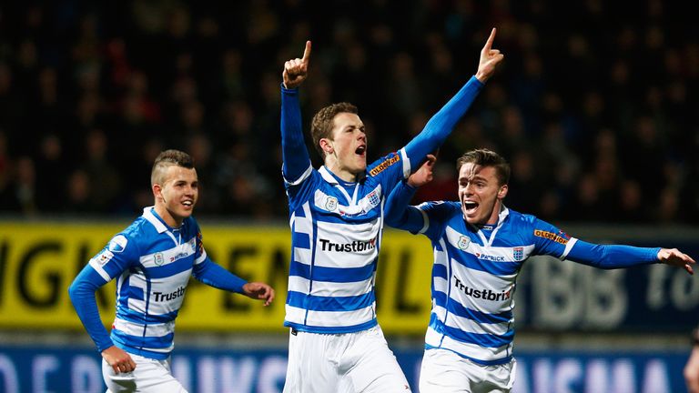 Thomas Lam of Zwolle (centre) celebrates scoring 