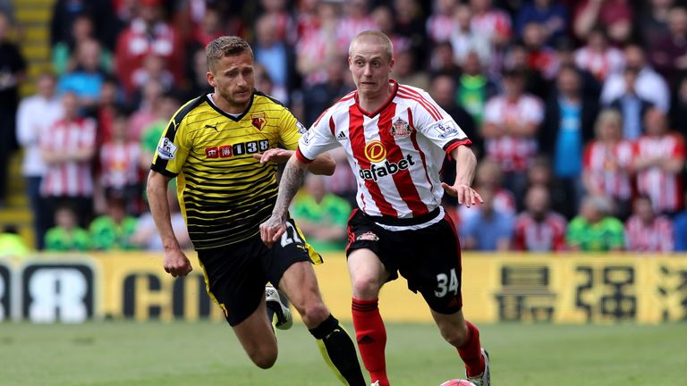 WATFORD, ENGLAND - MAY 15:  Tom Robson of Sunderland and Almen Abdi of Watford compete for the ball during the Barclays Premier League match between Watfor