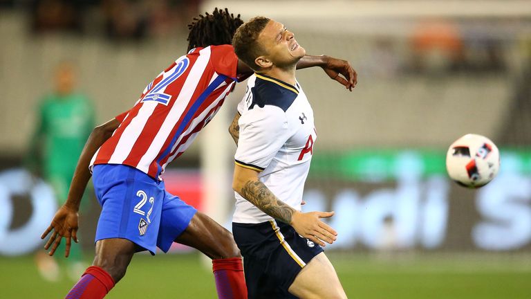 Tottenham's Kieran Trippier (r) is tackled by Atletico Madrid's Thomas Partey