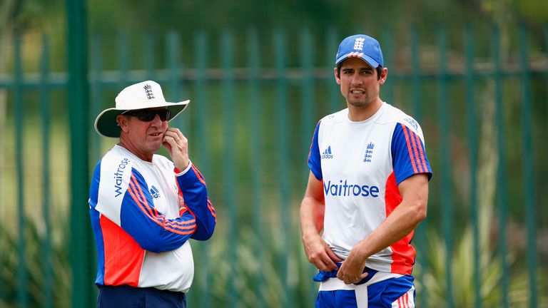 England coach Trevor Bayliss (left) and Alastair Cook talk during training