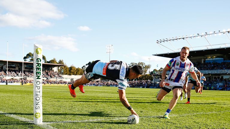 Valentine Holmes of the Sharks dives to score a try  during the round 20 NRL match between the Cronulla Sharks and the Newcastle Knights