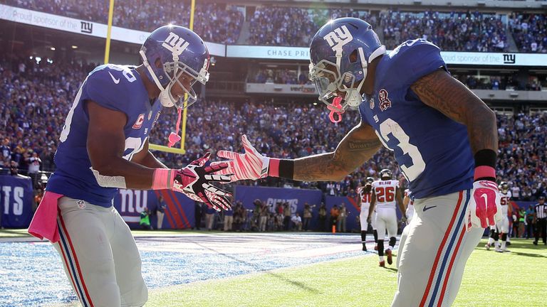 EAST RUTHERFORD, NJ - OCTOBER 05:  Wide receiver Odell Beckham #13 of the New York Giants celebrates with wide receiver Victor Cruz #80 after scoring a 15 
