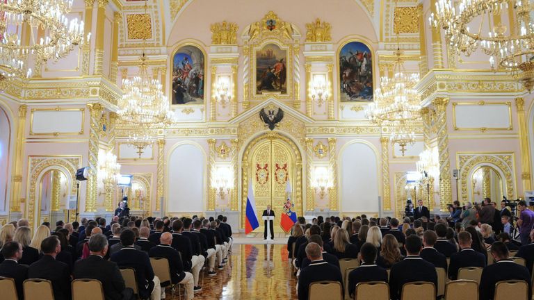 Vladimir Putin delivers a speech during a meeting with Russian athletes at the Kremlin