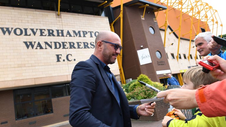 WOLVERHAMPTON, ENGLAND - JULY 30: Walter Zenga manager of Wolverhampton Wanderers signs autographs  for the fans as he arrives before the Pre-Season Friend