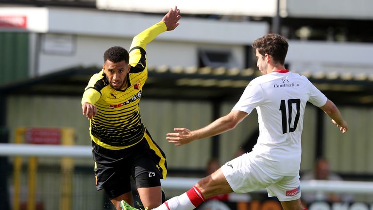 WOKING, ENGLAND - JULY 10: Etienne Capoue of Watford moves past Max Kretzschmar during the pre season friendly match between Woking and Watford at The Lait