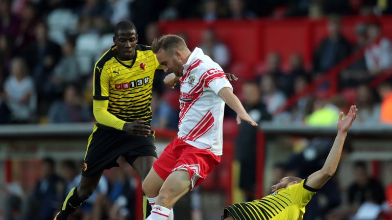 Stevenage's Charlie Lee and Watford's Adlene Guedioura (right) battle for the ball during a pre-season friendly at the Lamex Stadium, Stevenage.