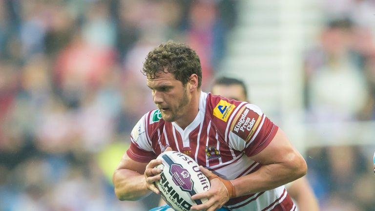 Wigan Warriors v St Helens - DW Stadium, Wigan, England - Wigan's Sean O'Loughlin is tackled by St Helens' Kyle Amor.