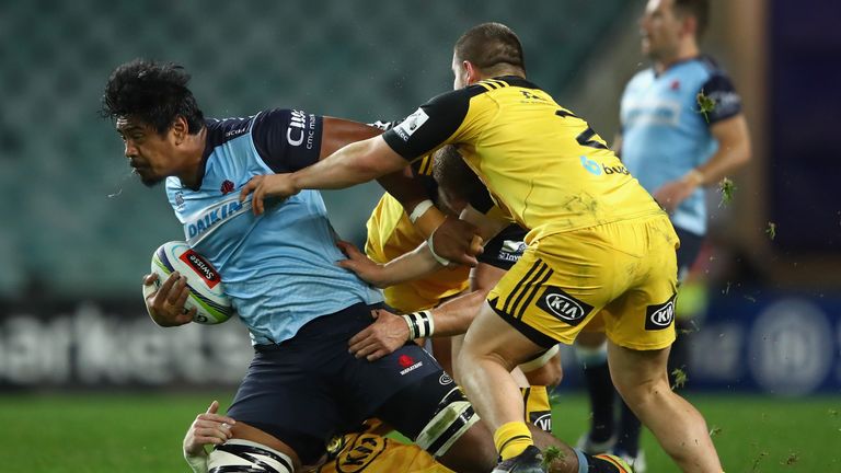SYDNEY, AUSTRALIA - JULY 09: Will Skelton of the Waratahs is tackled during the round 16 Super Rugby match between the Waratahs and the Hurricanes at Allia