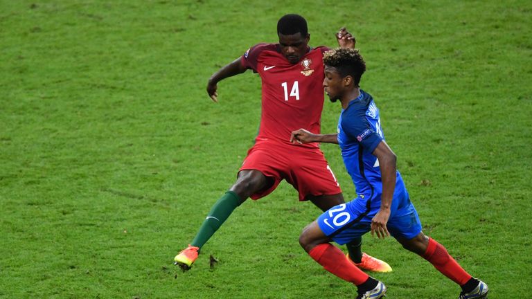Portugal's midfielder William Carvalho (L) and France's forward Kingsley Coman vie for the ball during the Euro 2016 final football match between Portugal 