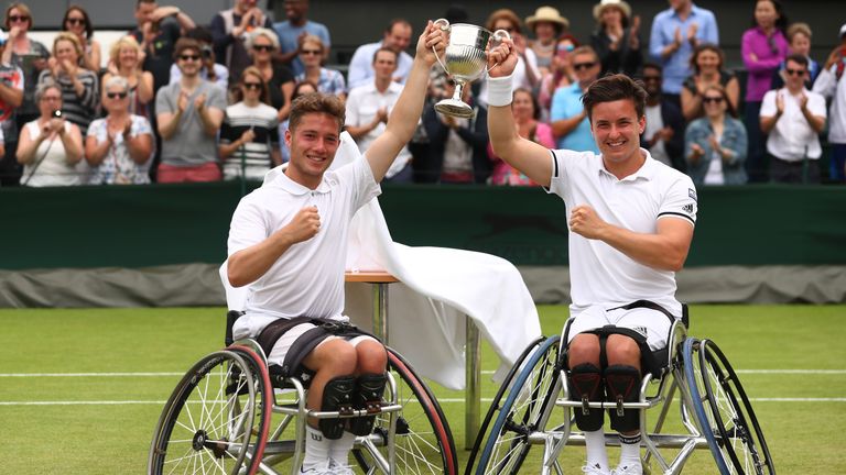 Gordon Reid (R) and Alfie Hewett of Great Britain (L) celebrate victory in the men's wheelchair doubles at Wimbledon