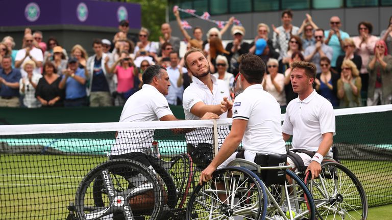 Gordon Reid and Alfie Hewett of Great Britain (right) are congratulated by Stephane Houdet and Nicolas Peifer