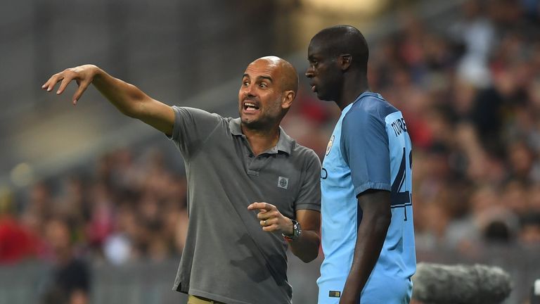 Pep Guardiola gives instructions to Yaya Toure