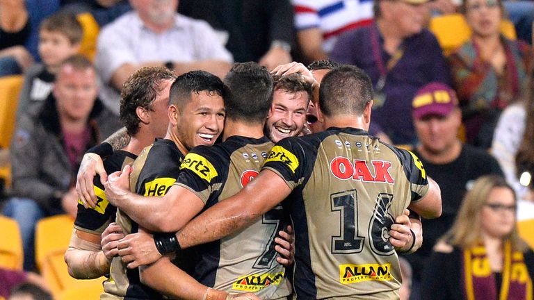 BRISBANE, AUSTRALIA - JULY 22:  Zak Hardaker of the Panthers is congratulated by team mates after scoring a try during the round 20 NRL match between the B