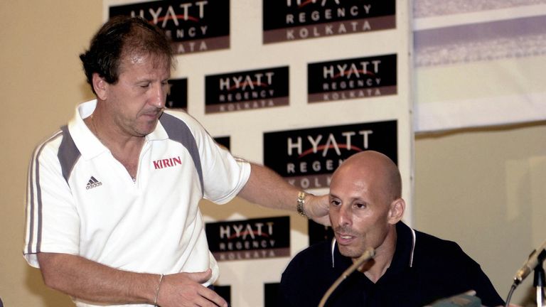 Brazilian coach of the Japan national football team Zico shakes hands with British coach of the India national team Stephen Constantine in 2004