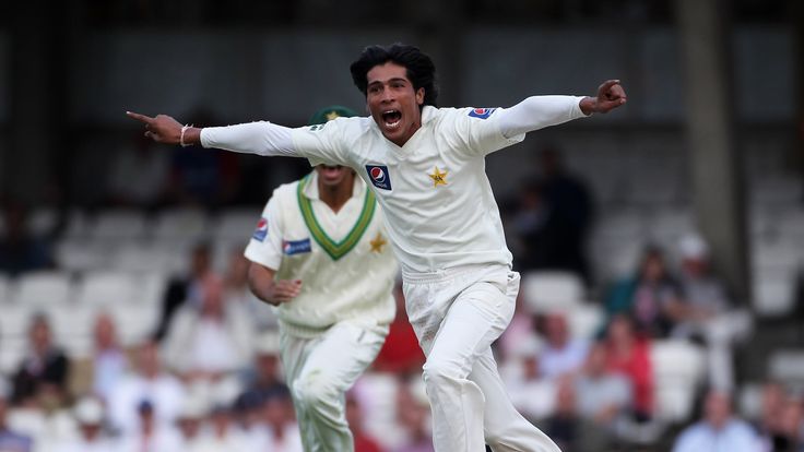 Mohammad Amir of Pakistan celebrates the wicket of Andrew Strauss of England