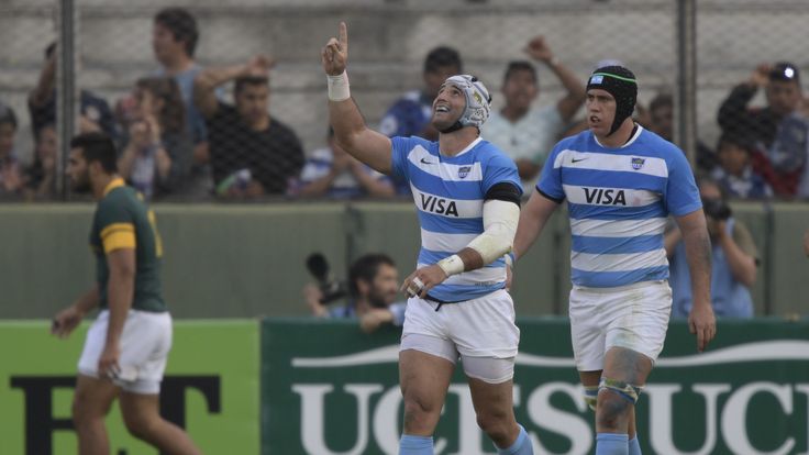 Argentina flanker Juan Manuel Leguizamon (c) celebrates next to team-mate Matias Alemanno after scoring a try against South Africa in Salta