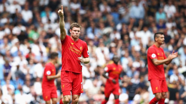 James Milner celebrates after scoring the first goal of the game