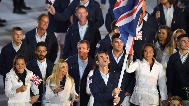 Andy Murray leads the Team GB delegation into the stadium