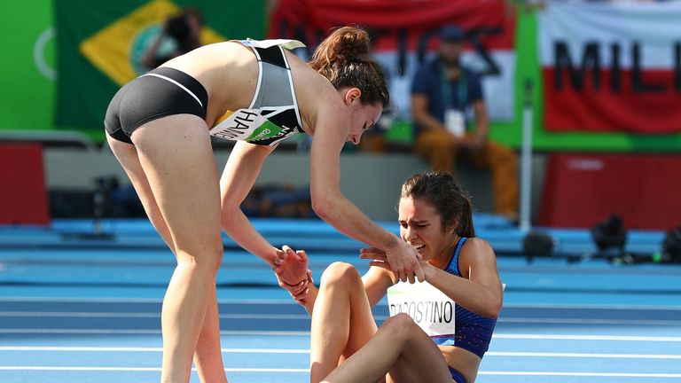 RIO DE JANEIRO, BRAZIL - AUGUST 16:  Abbey D'Agostino of the United States (R) is assisted by Nikki Hamblin of New Zealand after a collision during the Wom