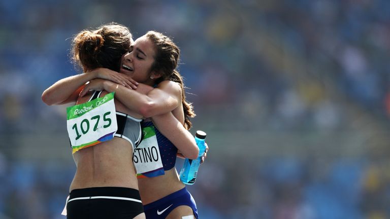 RIO DE JANEIRO, BRAZIL - AUGUST 16:  Abbey D'Agostino of the United States (R) hugs Nikki Hamblin of New Zealand after the Women's 5000m Round 1 - Heat 2 o