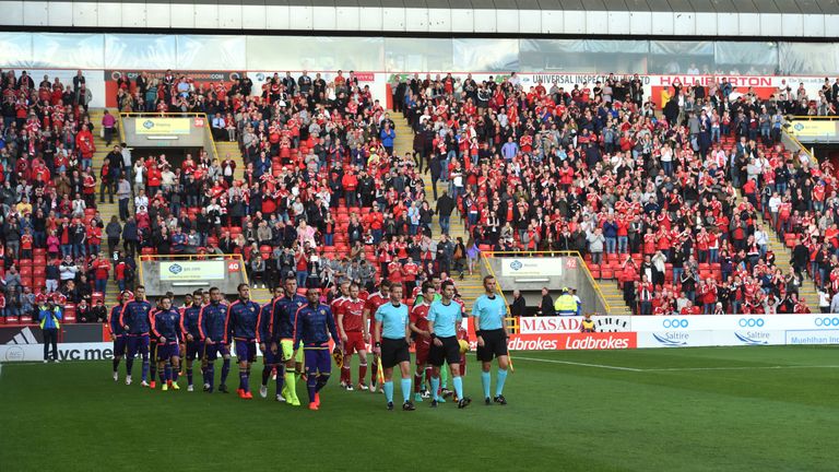 The teams make their way onto the pitch ahead of the Europa League tie between Aberdeen and Maribor at Pittodrie