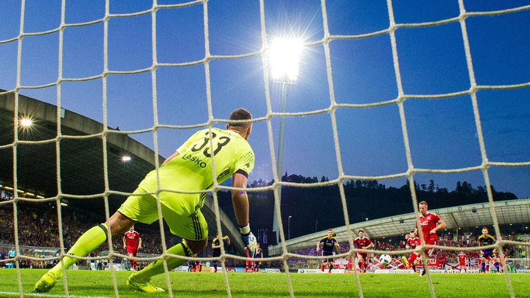 Maribor goalkeeper Jasmin Handanovic saves Aberdeen striker Adam Rooney's penalty in Europa League