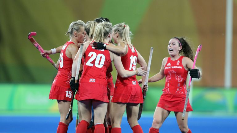 Great Britain's Alex Danson is mobbed by team mates after scoring the third goal 
