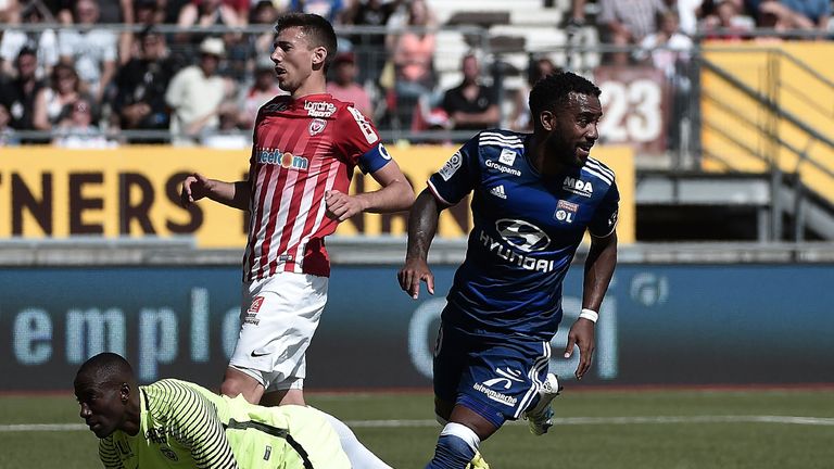 Lyon' French forward Alexandre Lacazette (R) celebrates after scoring a goal during the French L1 football match between Nancy (ASNL) and Lyon (OL), on Aug